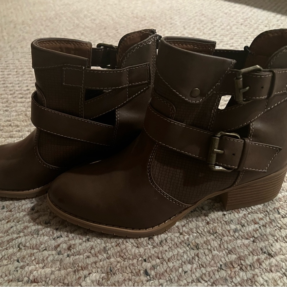 Brown booties with decorative buckles
